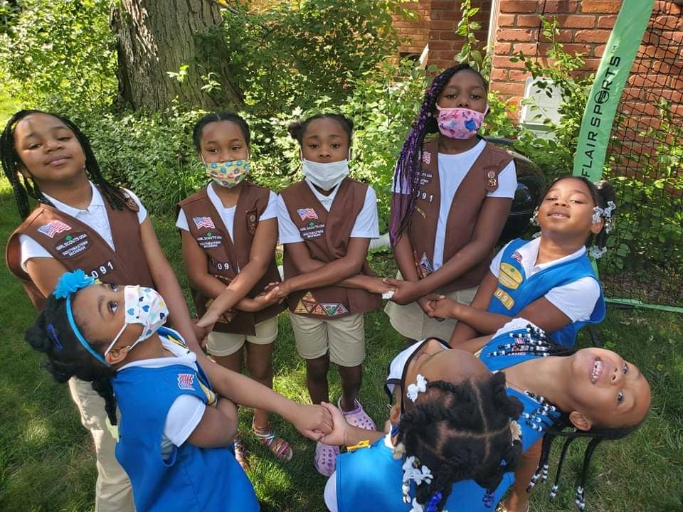 Daisy and Brownie Girl Scouts of Southeast Michigan helping to bridge their sister Juniors.